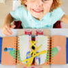 child-playing-busyboard.jpg" alt="Toddler playing with a double-sided wooden sensory busy board